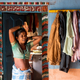 Bagabai, first wife of Namdeo, listens to him inside their house